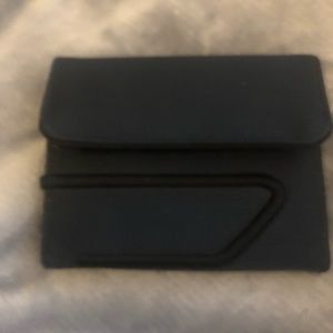 Men’s Diesel wallet.  Navy blue with Velcro closures. Great condition.